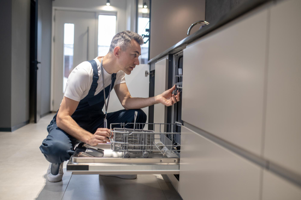 How To Install An Integrated Dishwasher   Kitchen Facilities Profile Man Touching Details Kitchen Lit By Daylight (1) 